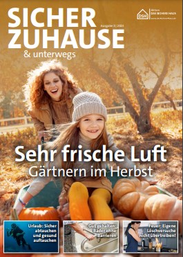 Titelseite des Magazins: Eine Frau schiebt eine Schubkarre mit Kind und Kürbissen