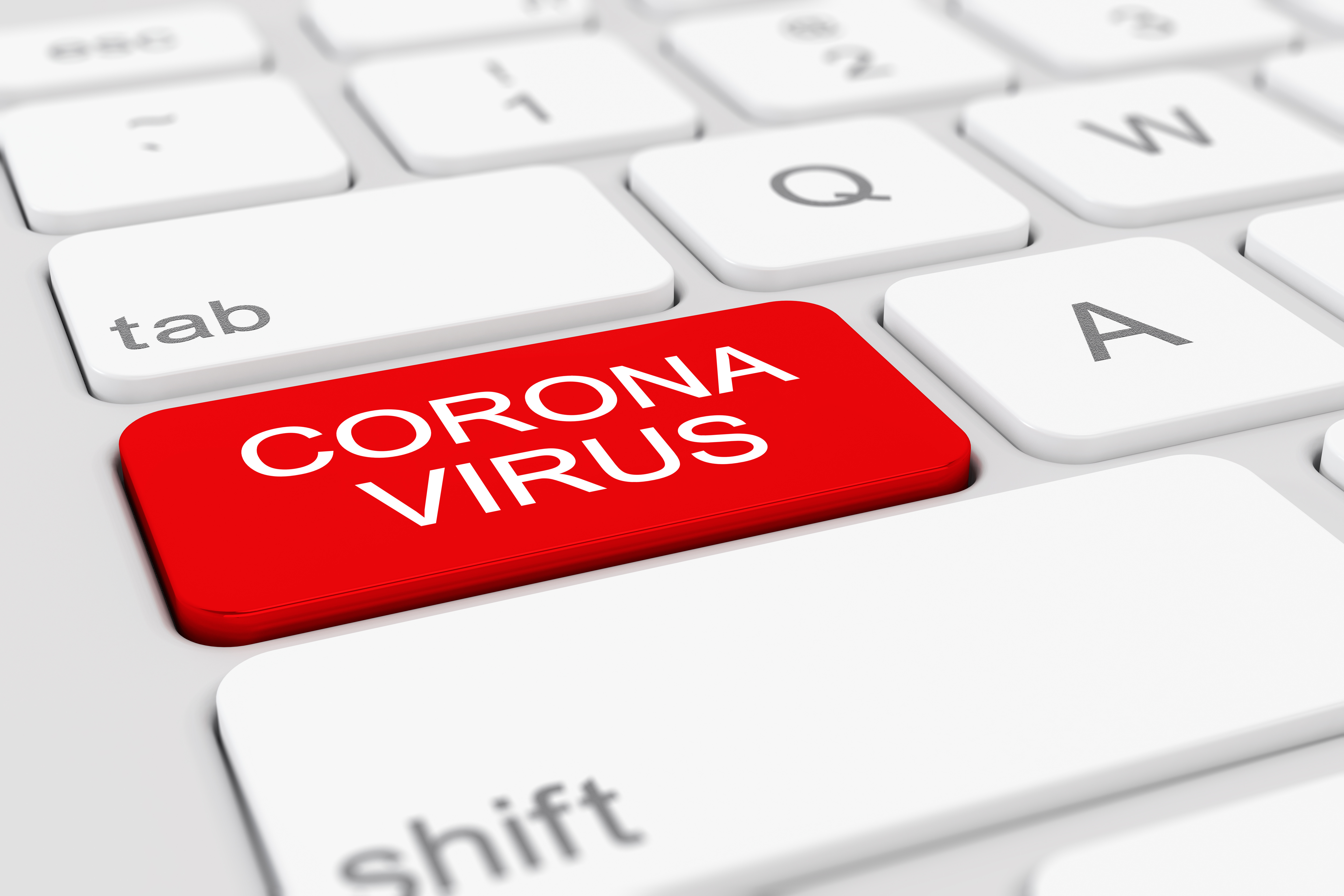 PC-Tastatur mit Wort Corona auf roter Taste